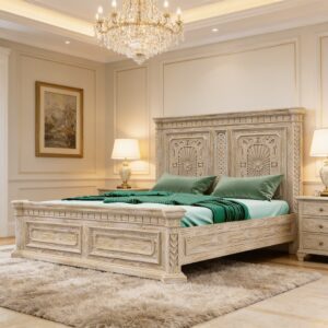 Hand-carved white wooden bed frame with floral panels and whitewashed finish, made from solid mango wood with slatted base and corner posts.