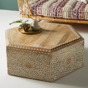 Hand-carved hexagonal coffee table made from solid mango wood with intricate white floral patterns, crafted by artisans in India – The Craftology