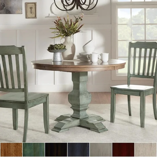 Handcrafted round pedestal dining table with antique sage green base by The Craftology